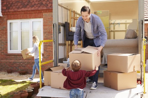 Office removal planning in Barking with business furniture and boxes