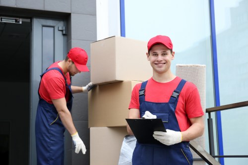 Staff sorting recyclable cardboard and packaging at Barking Storage