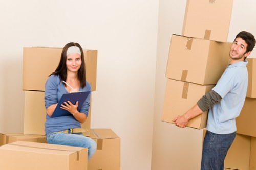 Boxes and furniture arranged inside a short-term storage unit in Barking