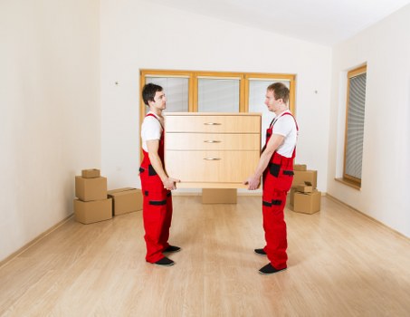 Moving team unloading items at a residential building in Barking